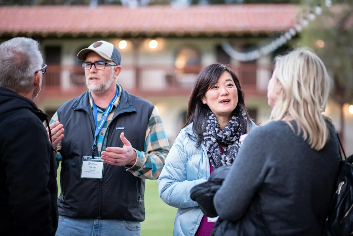 People in conversation at a community gathering